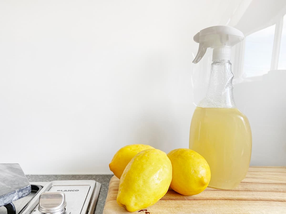 Natural eco-friendly cleaning products with fresh lemons