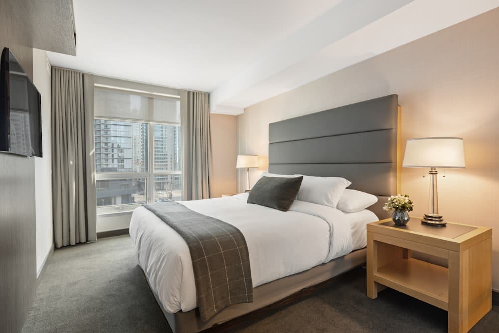 Freshly made bed in a guest-ready vacation rental